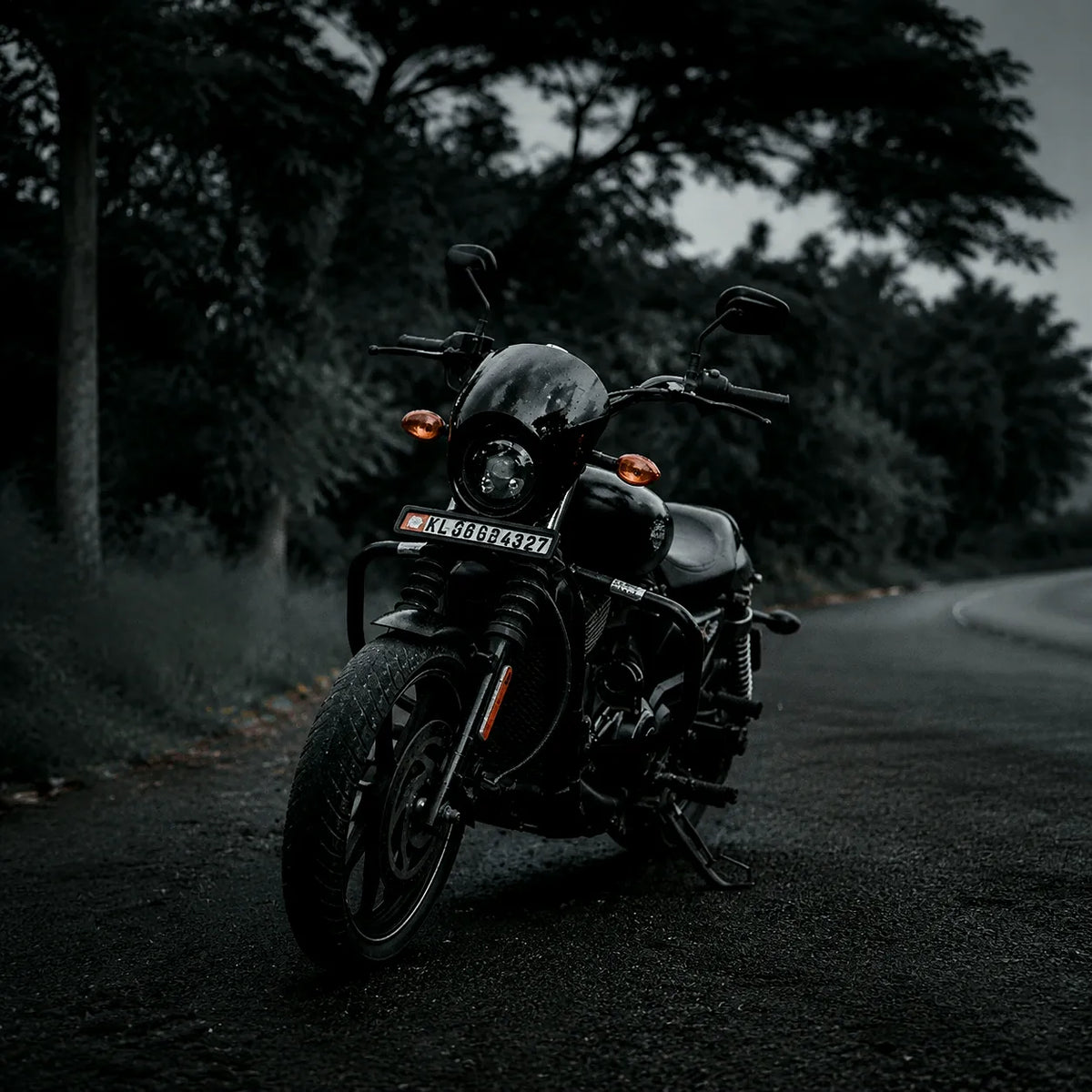 Classic motorcycle on a forest road