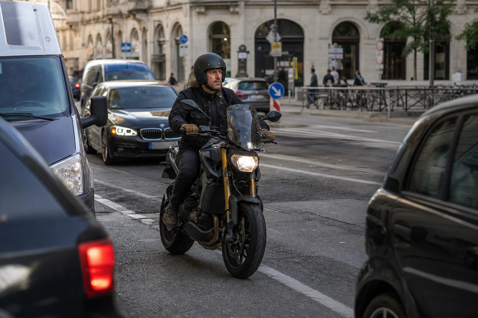 European scooter rider using urban motorcycle accessories in a Southern European city