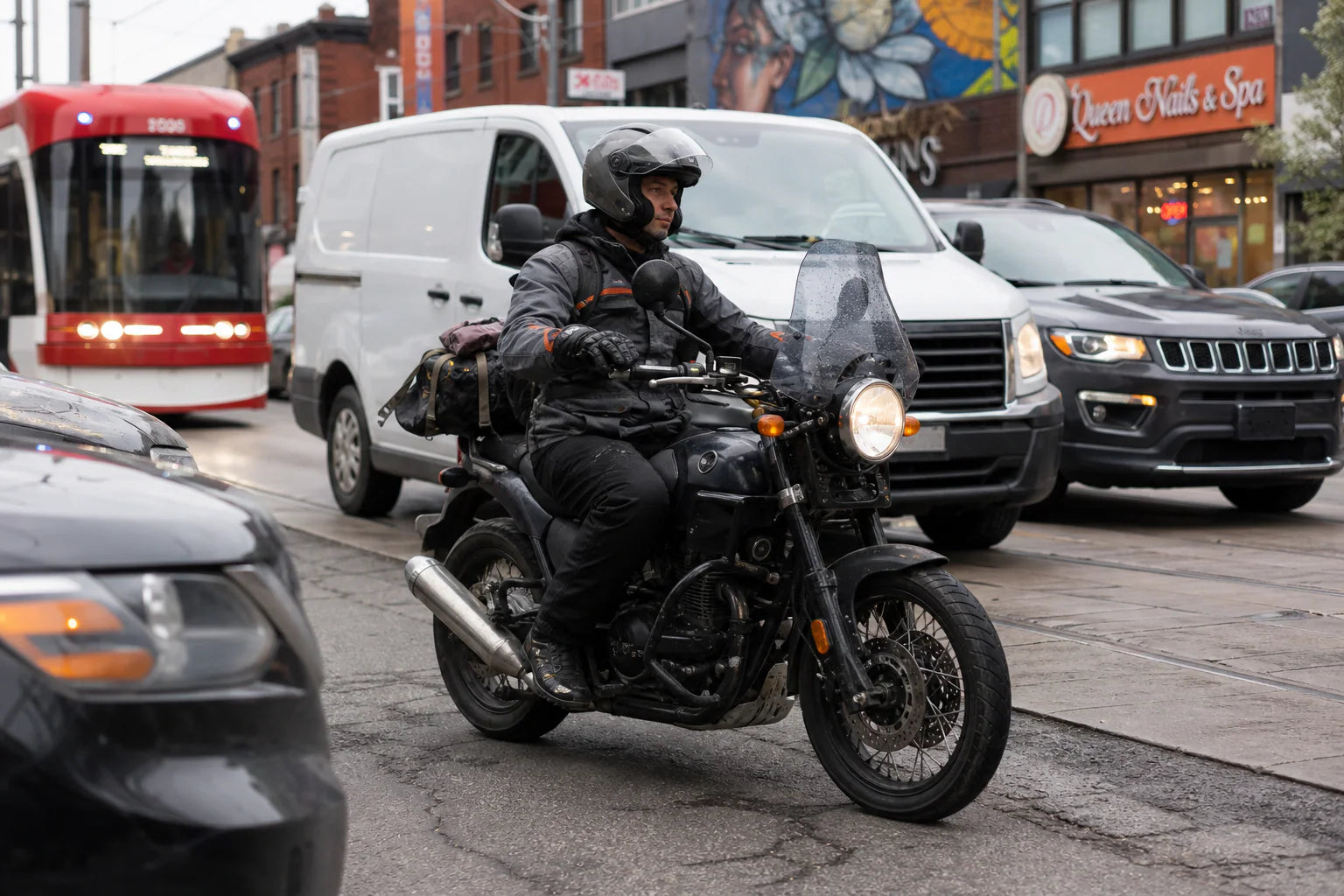 North America cruiser motorcycle rider using touring accessories on the road
